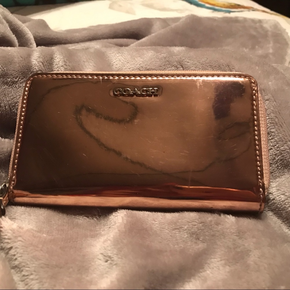 Rosegold patent leather Coach wallet.